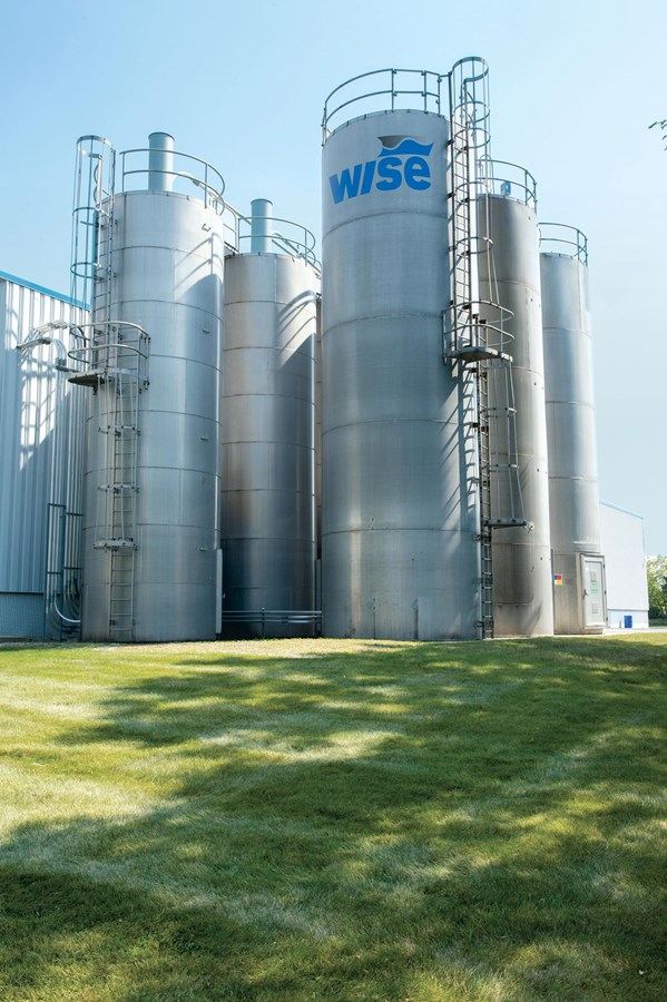 Wise-branded stainless steel bulk resin silos — seven silos with 750,000 lbs of storage capacity